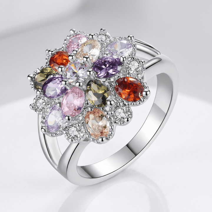 Anel de prata Rainbow Gemstone Burst da Rose & Oliver com pedras coloridas brilhantes e design elegante.