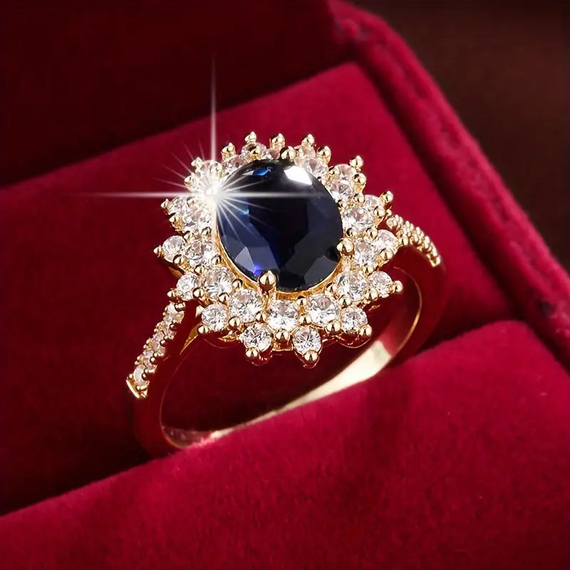 Anel Vionne Saphirae Rose & Oliver em ouro, com design delicado e detalhes elegantes, destacando-se na imagem.